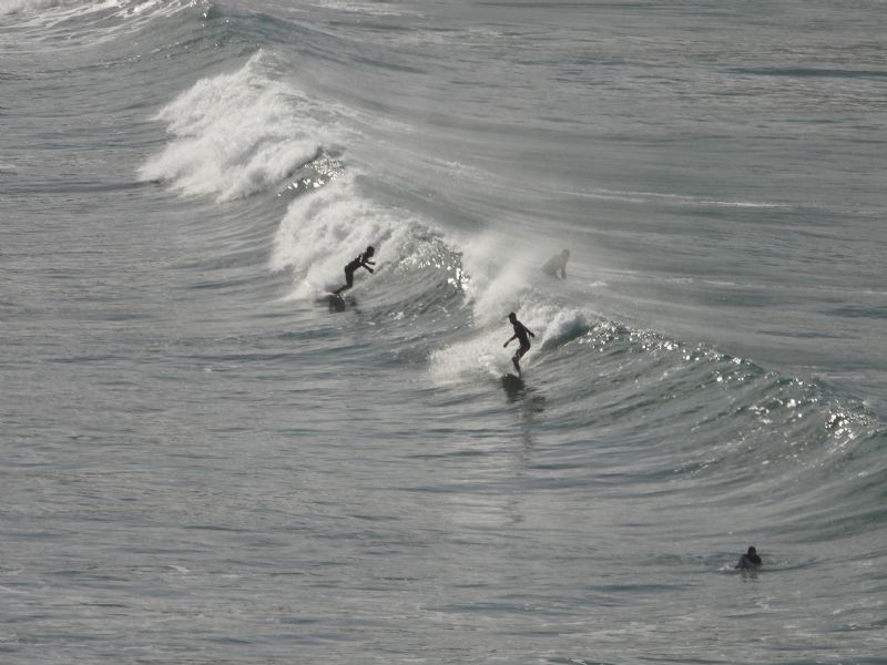 Surfers at Holywell Bay
