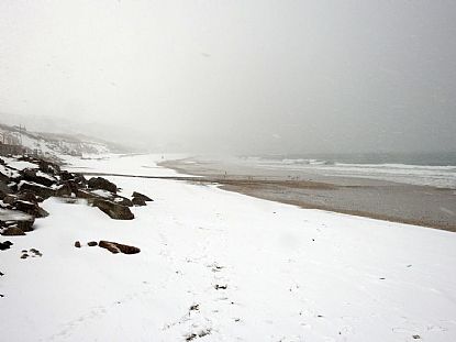 Snow-covered Praa Sands Beach towards Hendra